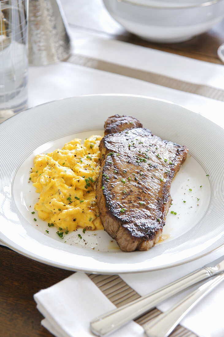 Sirloin steak with scrambled egg for brunch (USA)