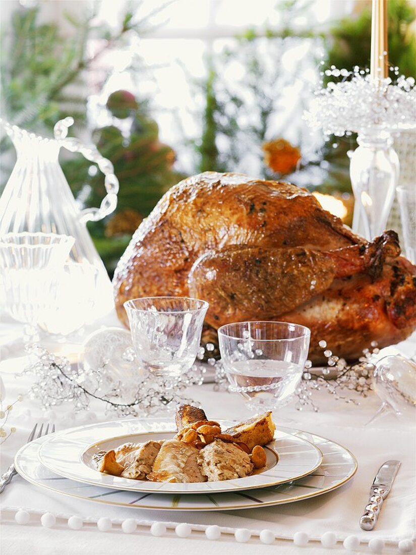 A roast turkey on a festive table