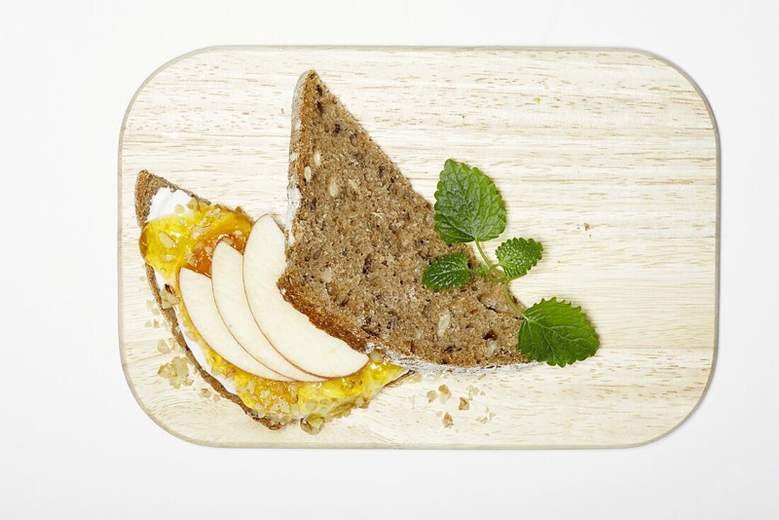 Apricot jam and apple slices on wholemeal bread