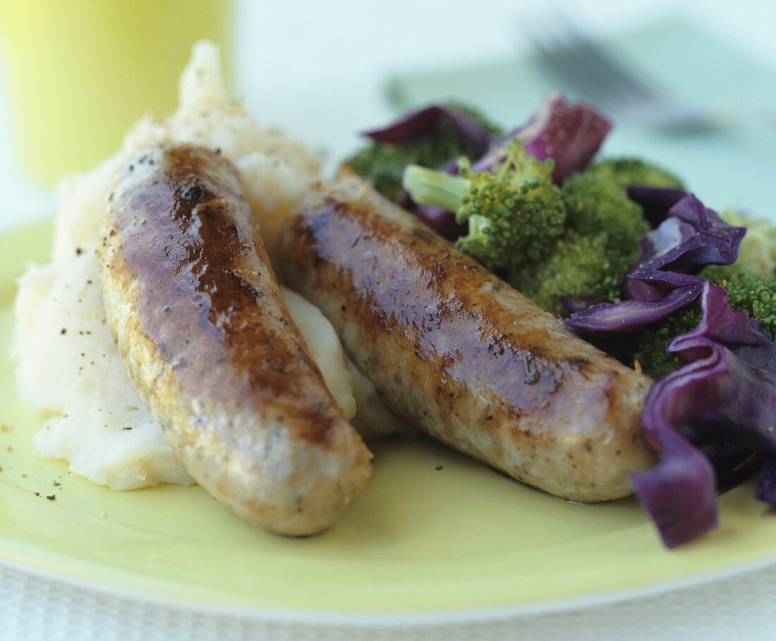 Fried sausages with mashed potato and broccoli