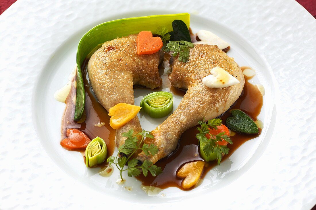Roasted poussin legs with vegetables