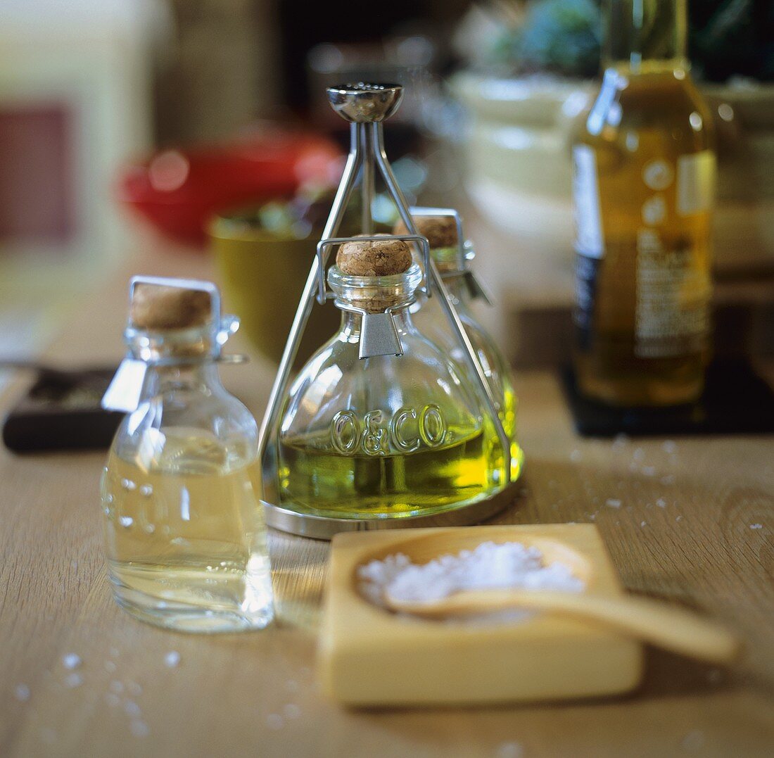 Olive oil, vinegar and sea salt on a wooden table