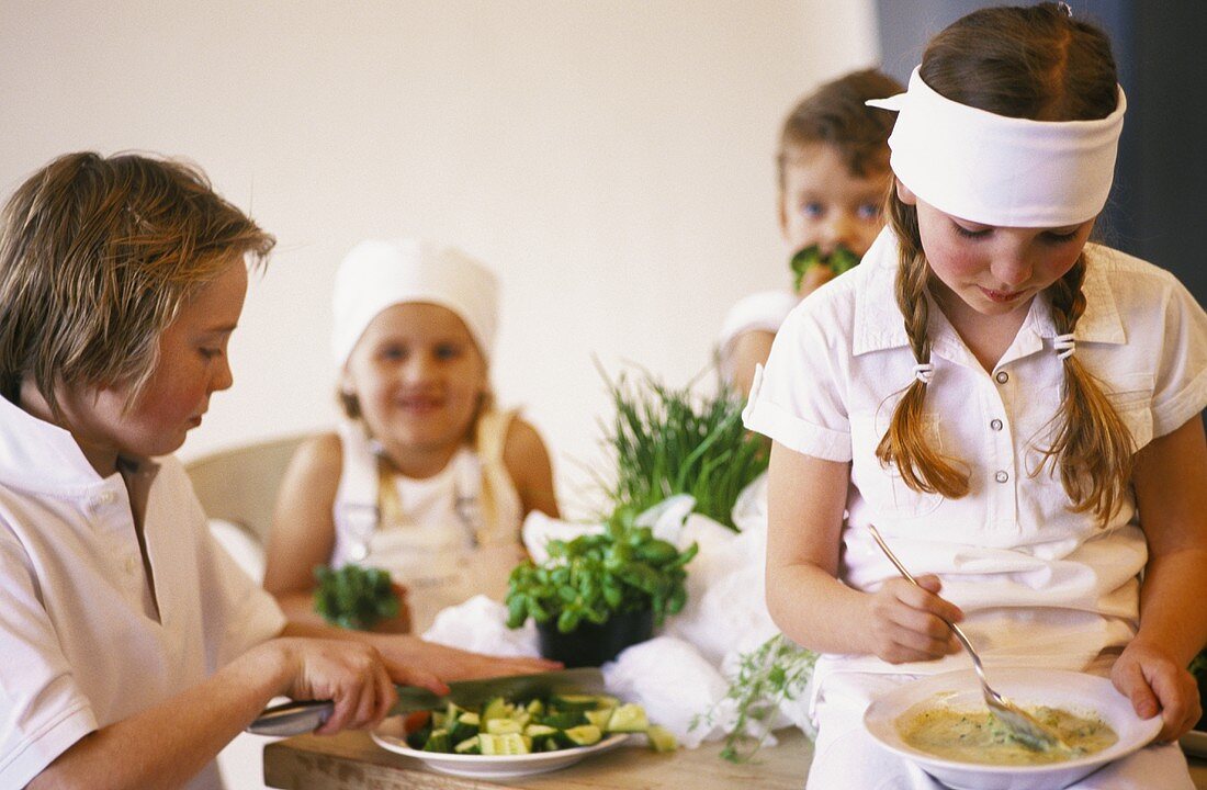 Four children cooking