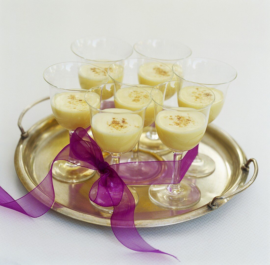 Seven glasses of advocaat on silver tray