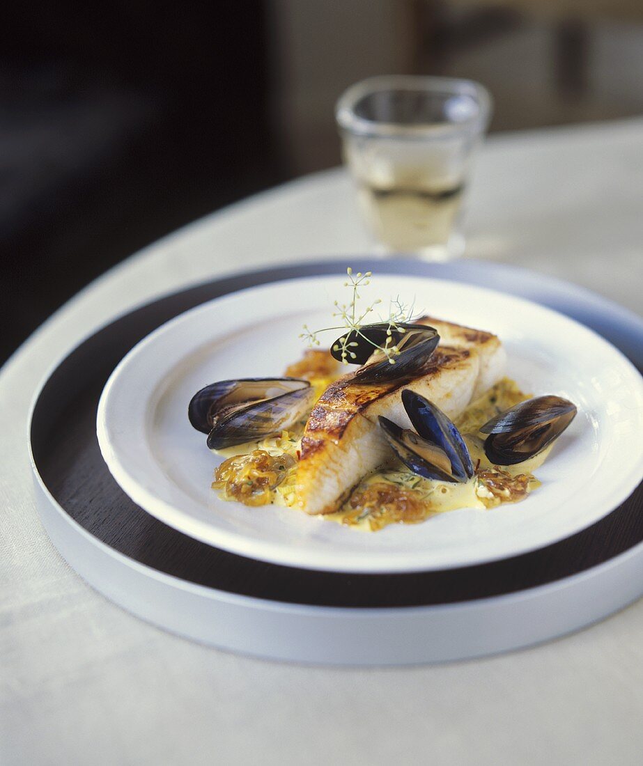 Fried fish with mussels and onion sauce