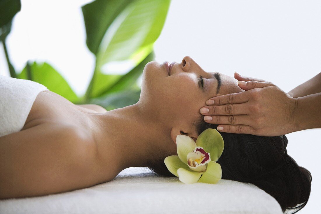 A woman having a head massage