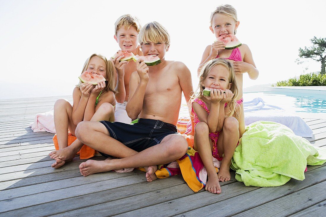 Kids eating watermelon