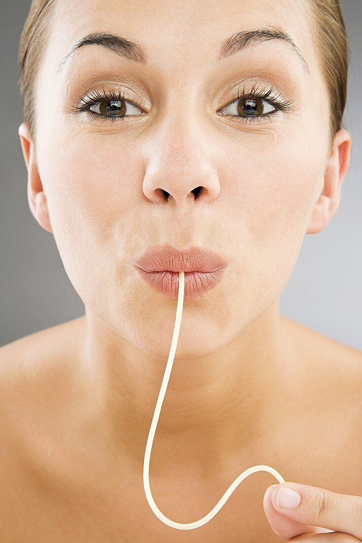 A woman eating spaghetti