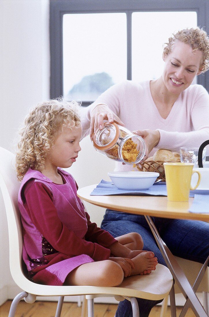 Mother and daughter at breakfast