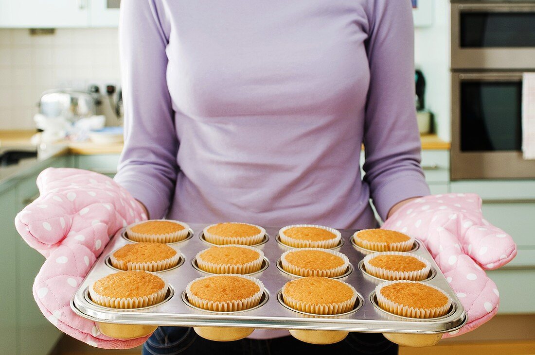 A woman baking cakes