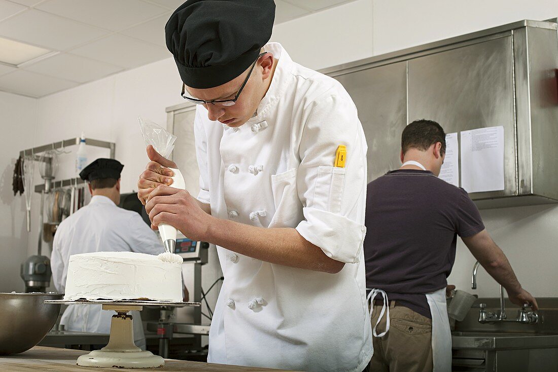 Cake being made in a commercial kitchen