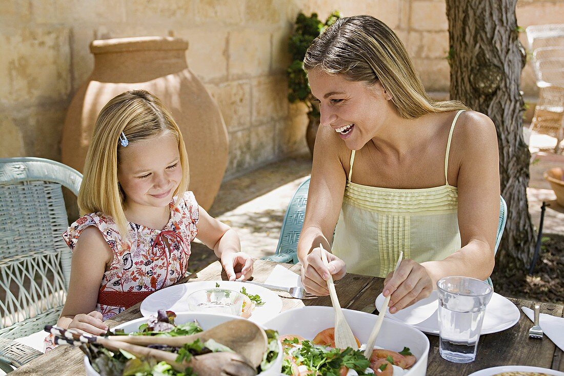A mother and daughter dining al fresco