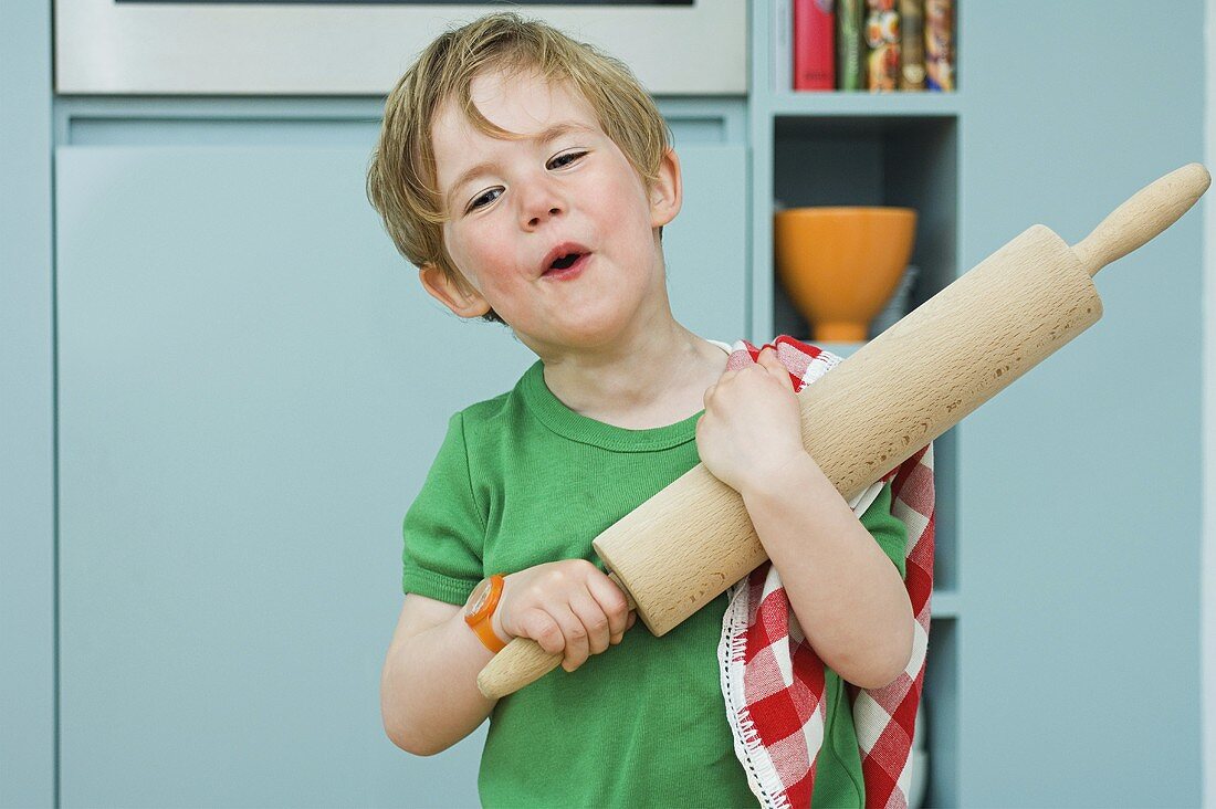 A boy with a rolling pin