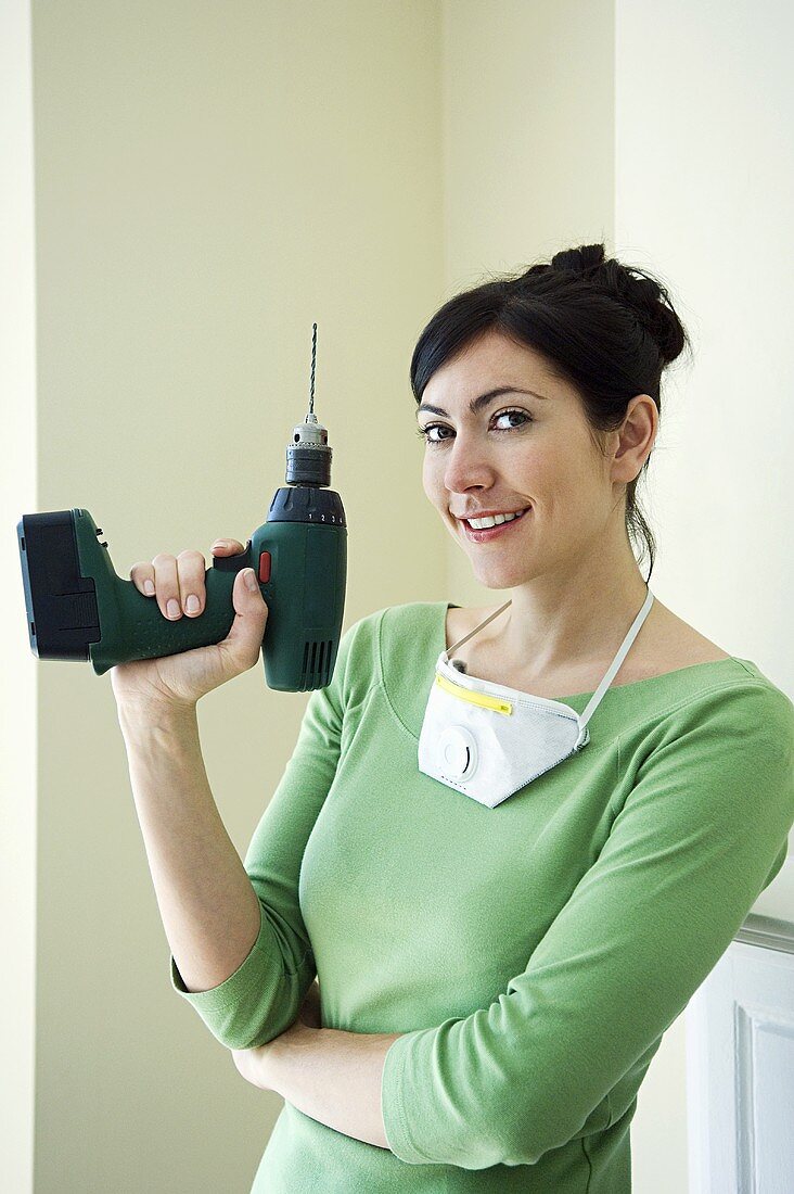 Woman with a power drill