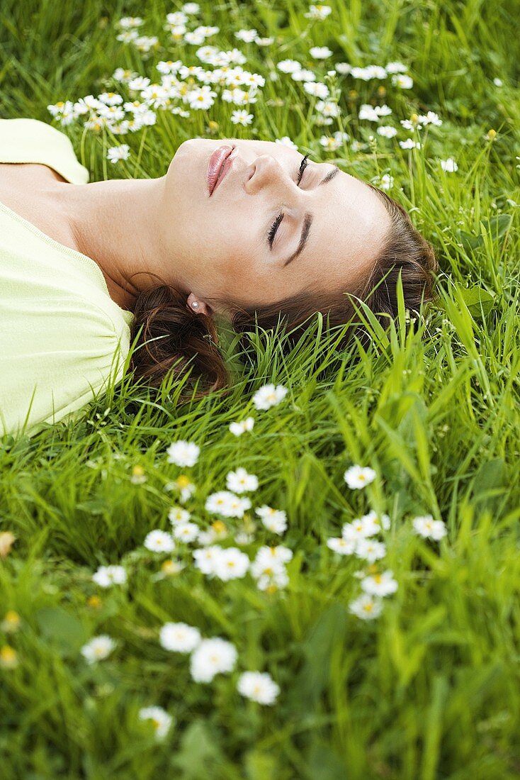 Woman sleeping on grass