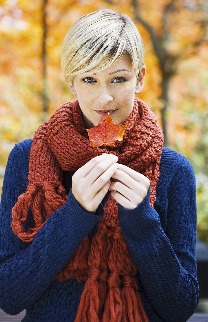 Young woman with leaf