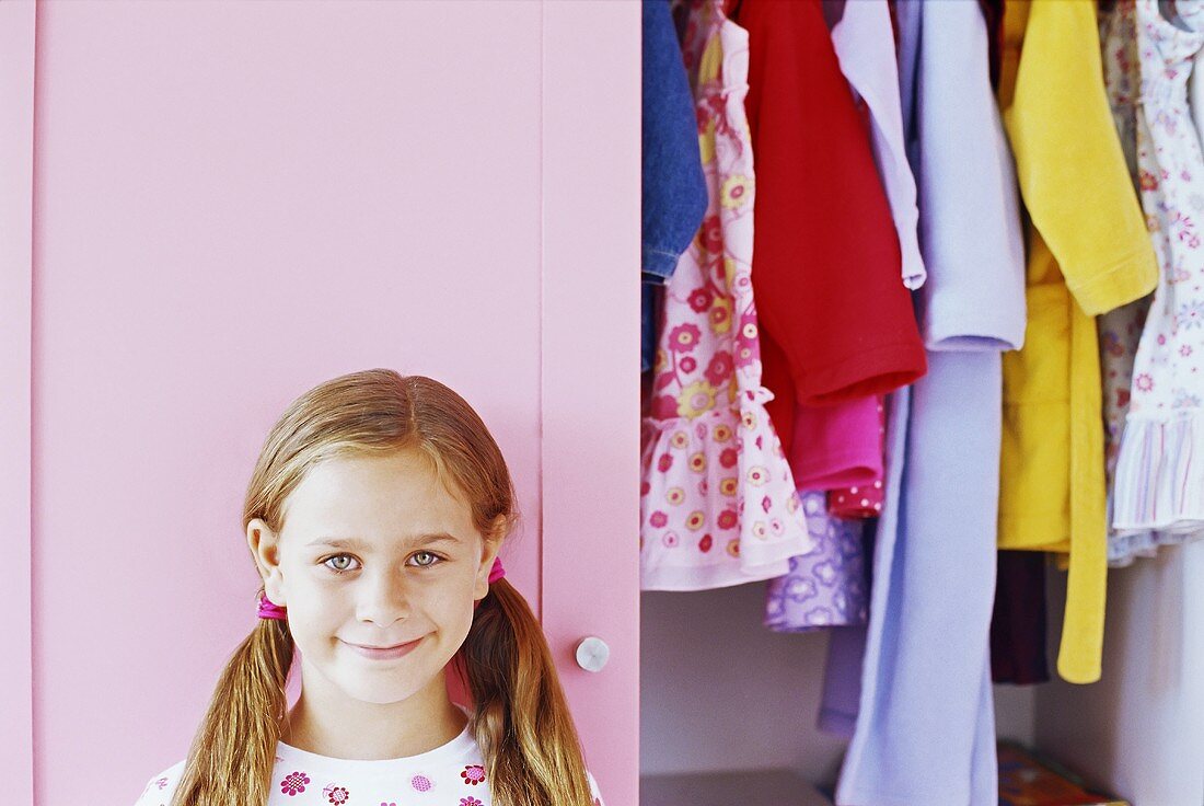 A girl in front of her wardrobe