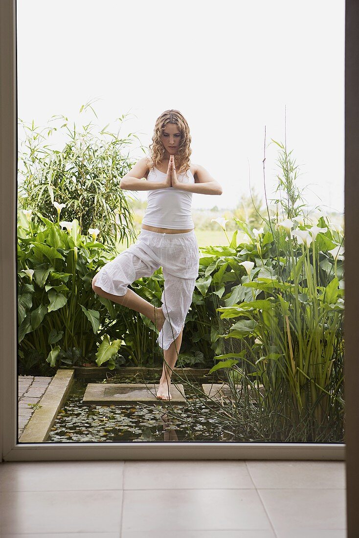 A young woman practising yoga