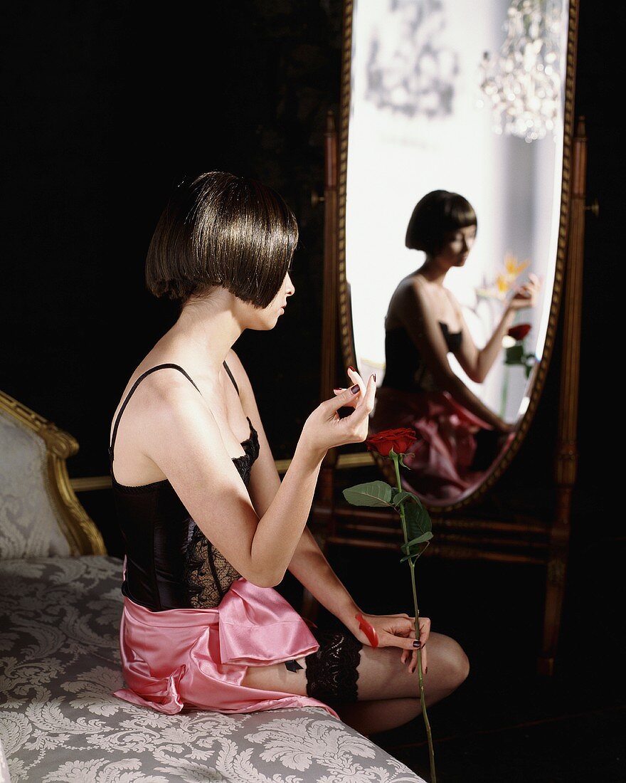 Young woman holding a rose