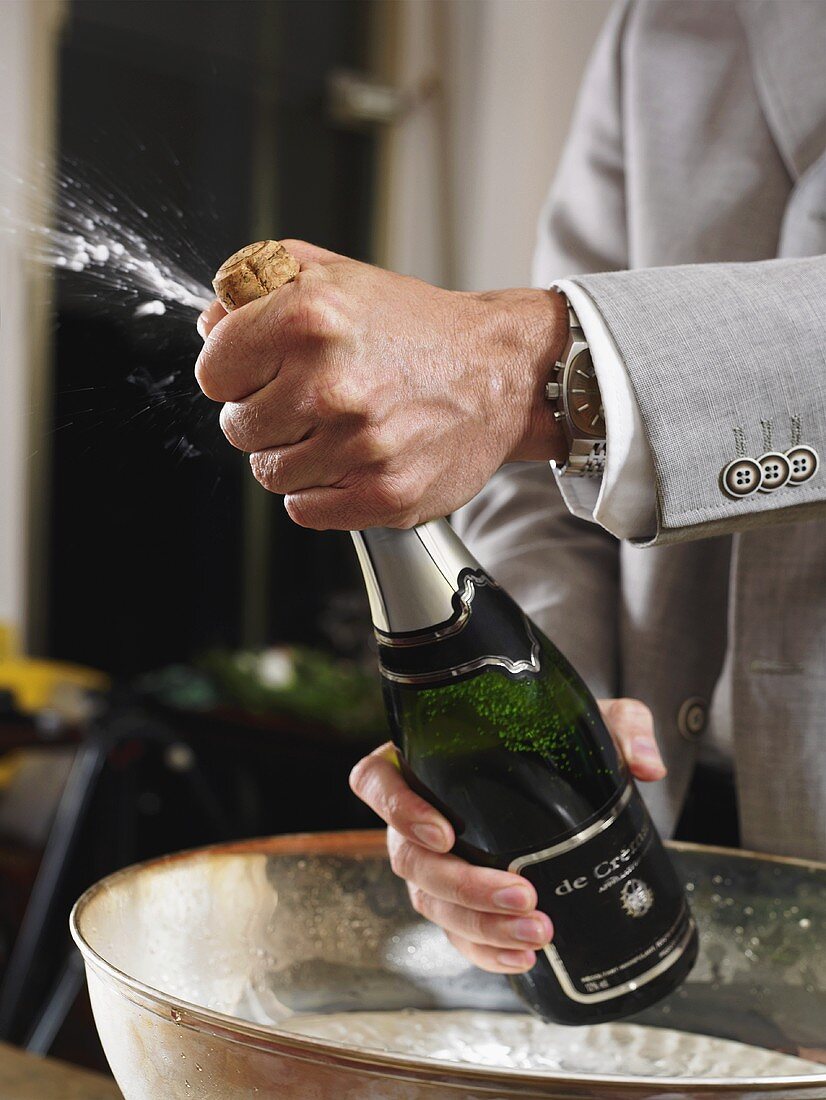A champagne bottle being opened