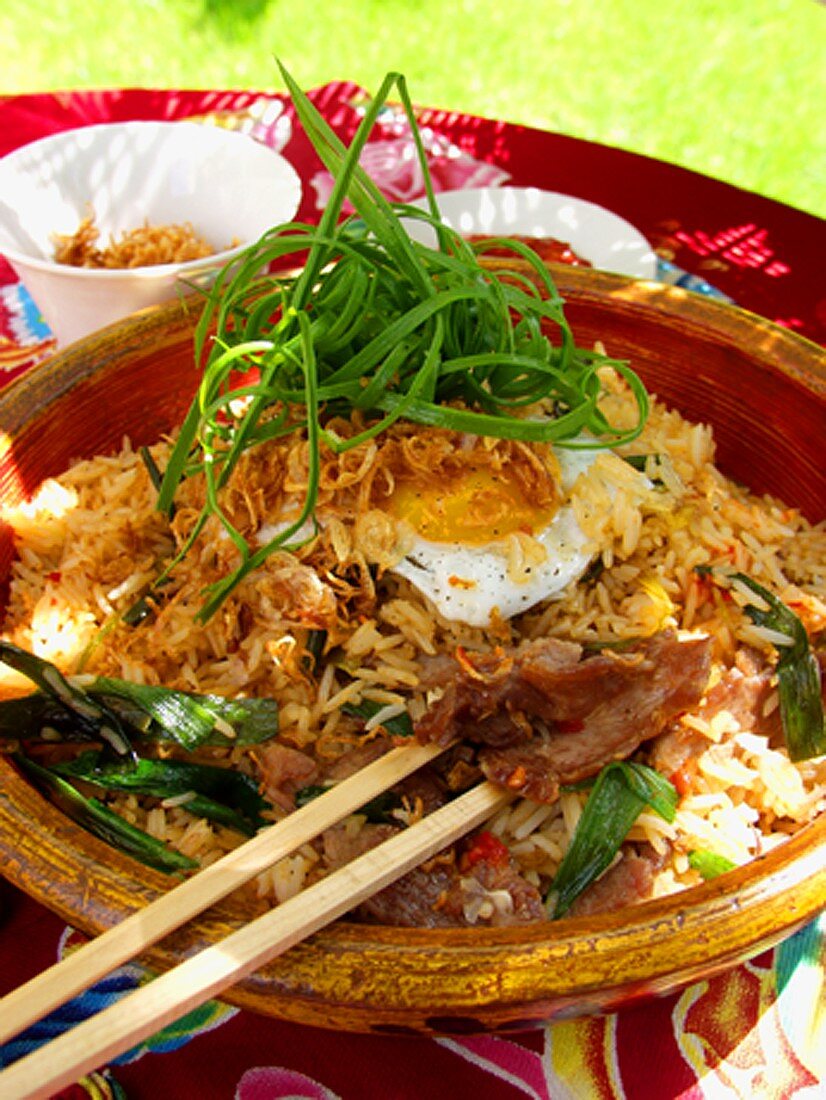 Nasi goreng with fried egg and spring onions