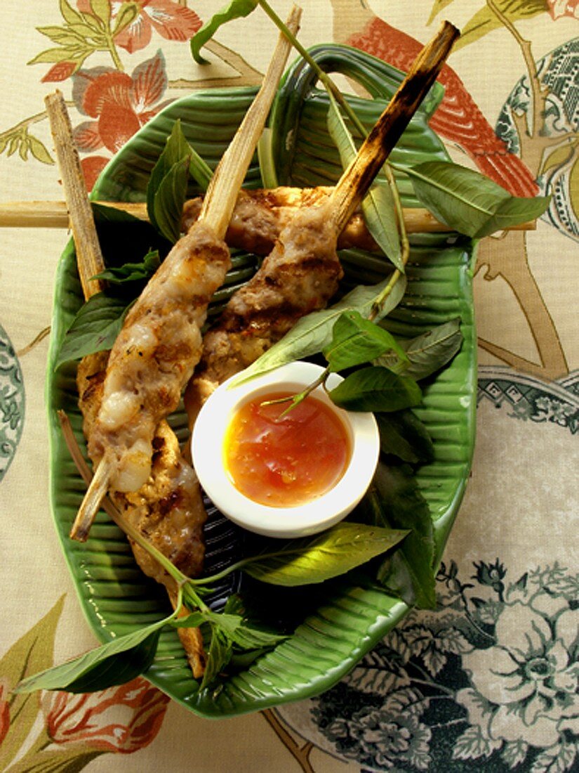Pork and shrimp kebabs with spicy sauce