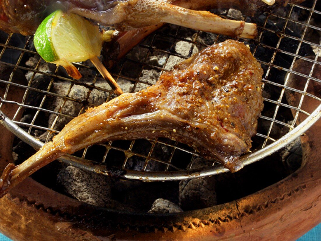 Lamb chops on the barbecue with lime