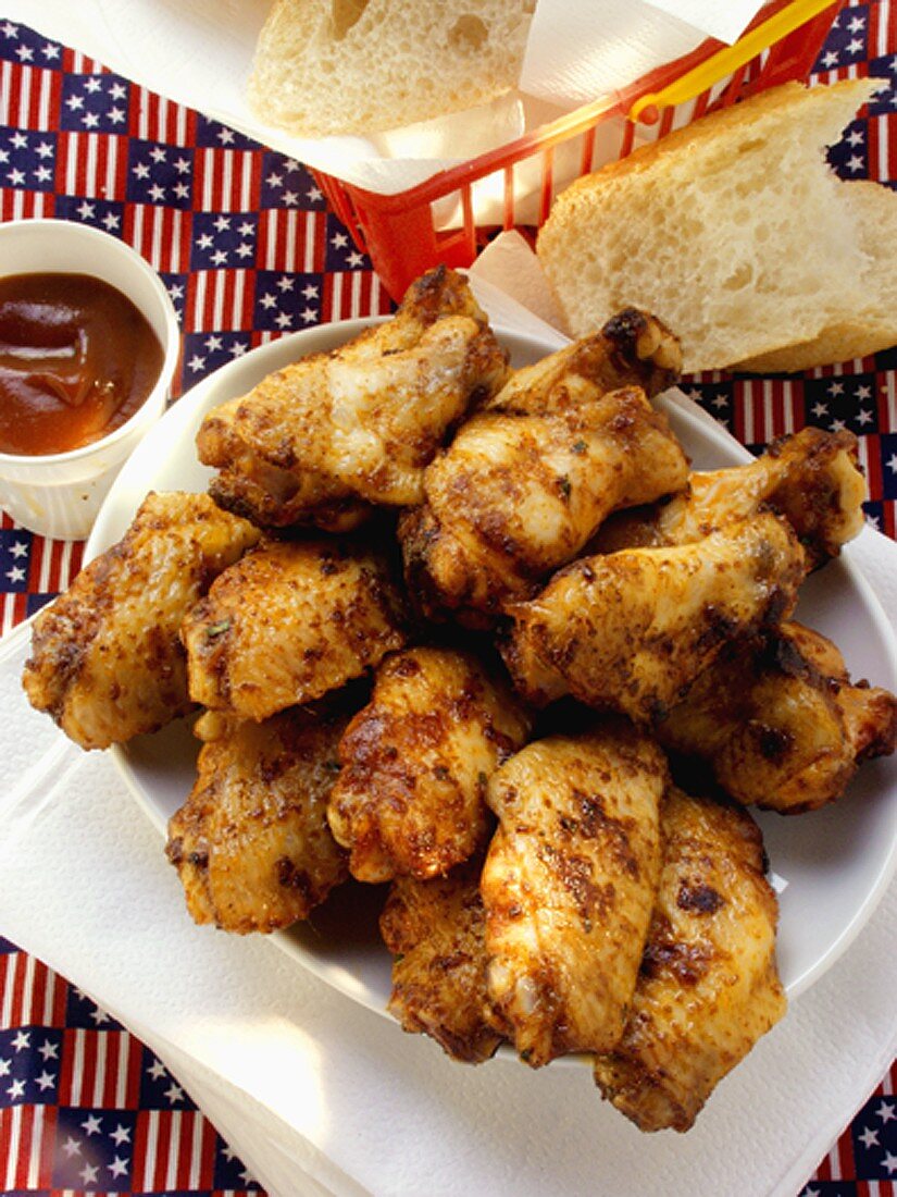 Barbecued chicken wings; barbecue sauce; white bread