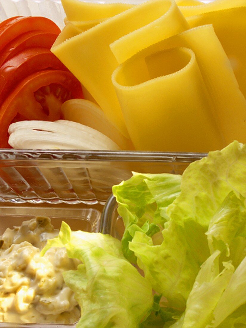 Sandwich ingredients: cheese, tomatoes, lettuce