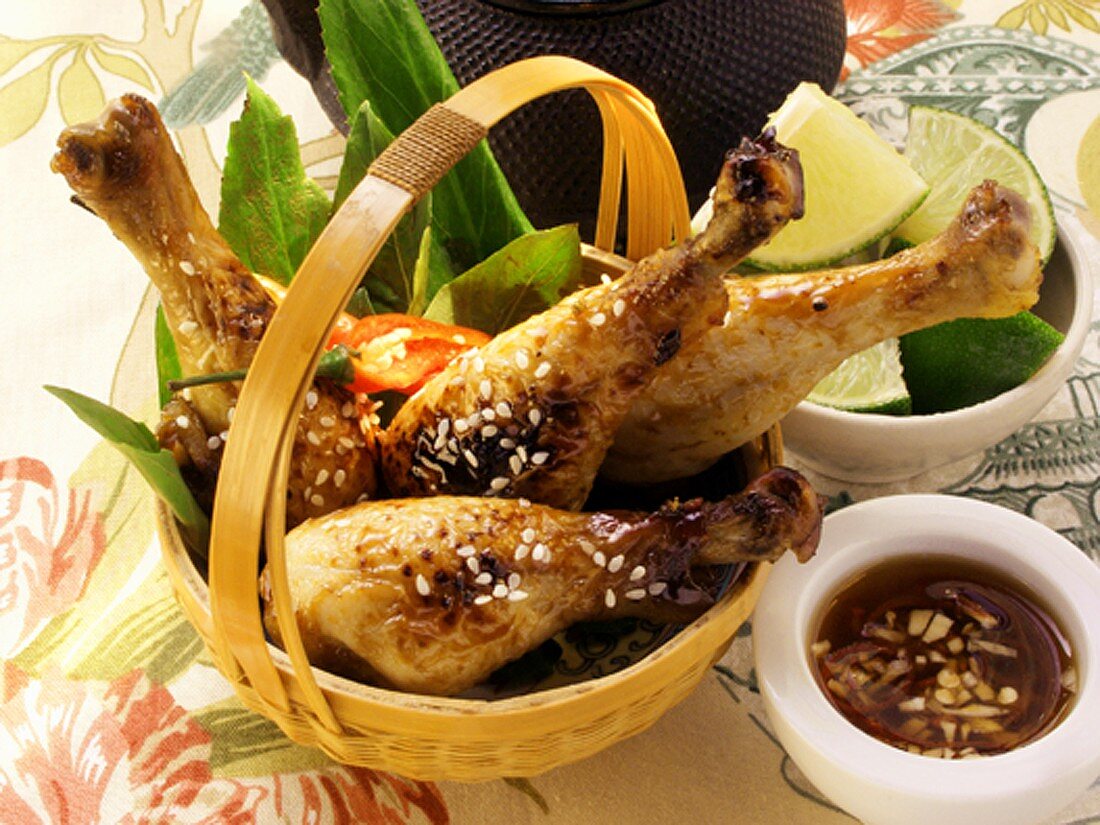 Asian chicken legs with sesame; limes; garlic sauce