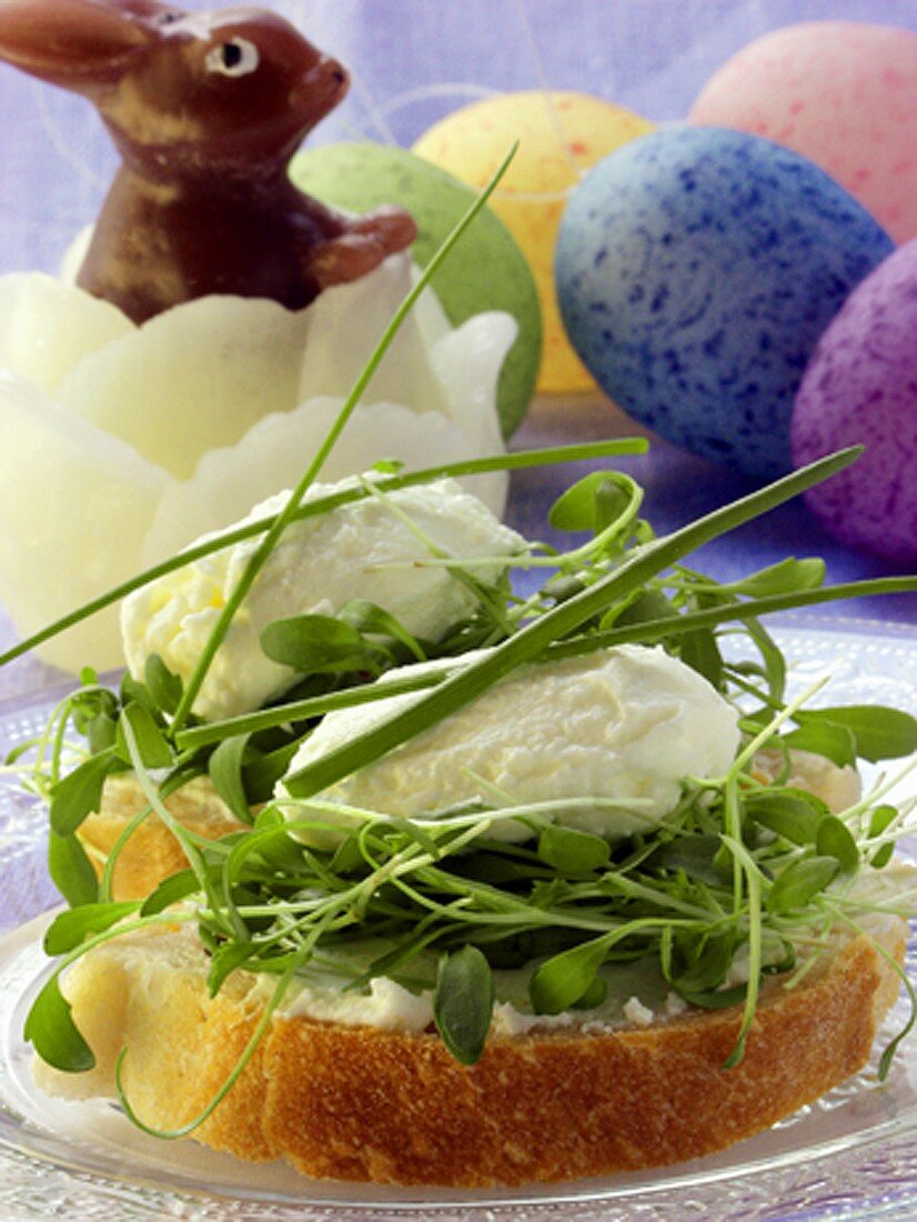 Cream cheese sandwich with cress; wax Easter Bunny; Easter eggs