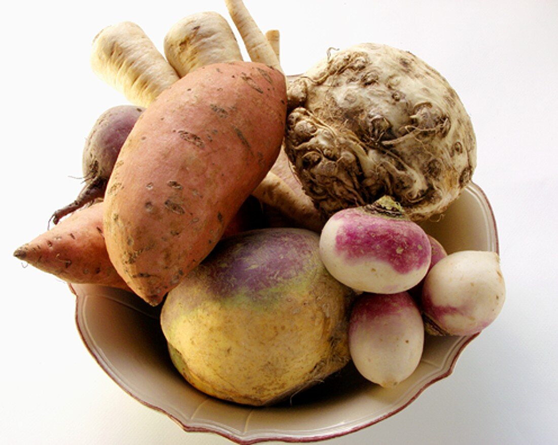 Various types of root vegetables in bowl