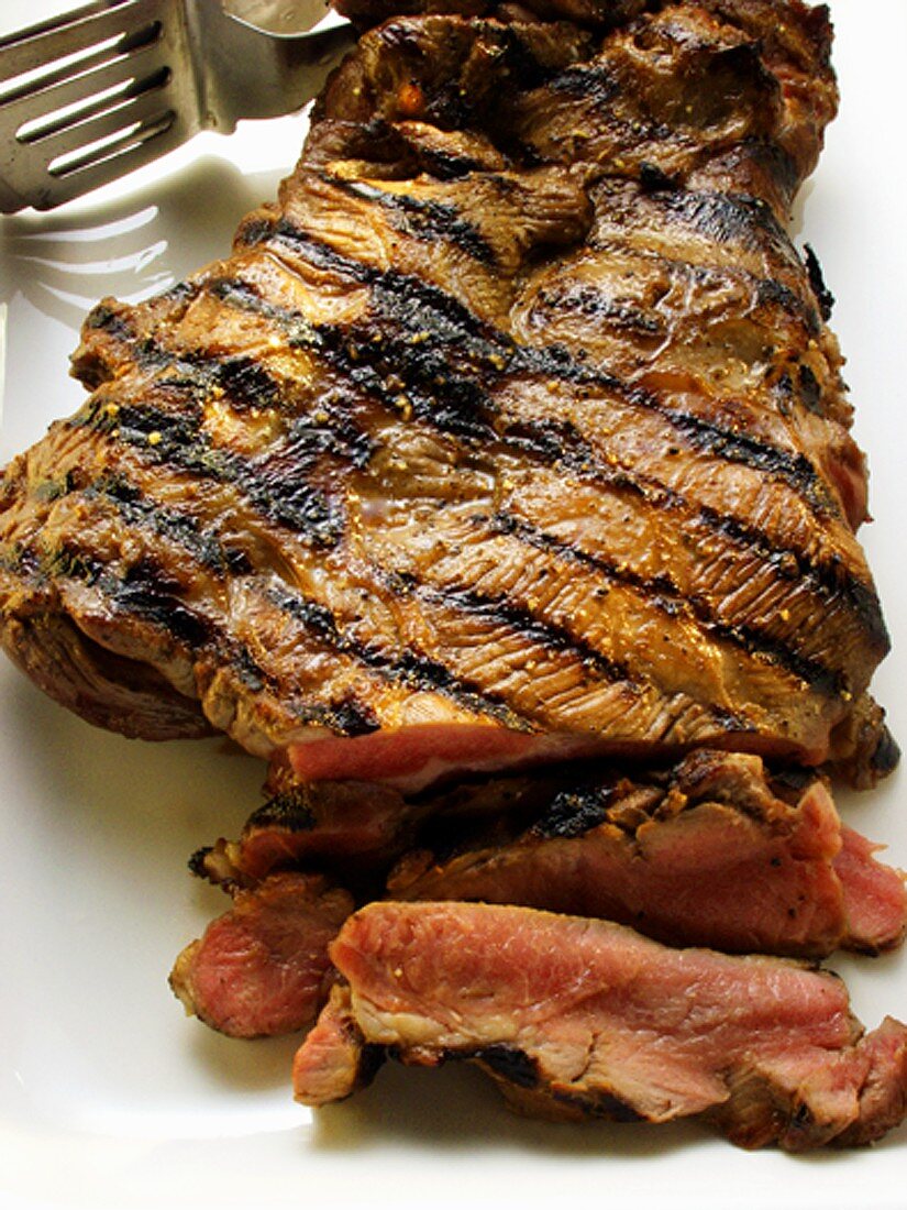 Barbecued lamb steak, a piece cut out