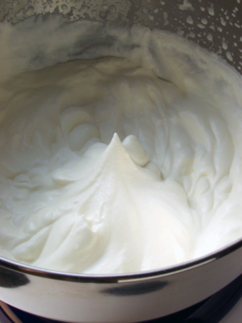 Whipped cream in mixing bowl