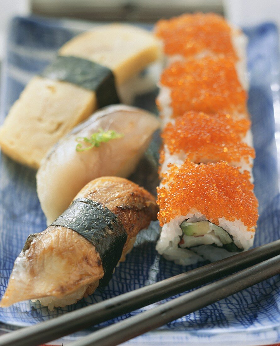 Nigiri sushi with mackerel, eel and egg custard; Maki sushi