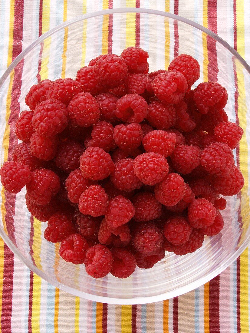 Fresh raspberries in glass dish