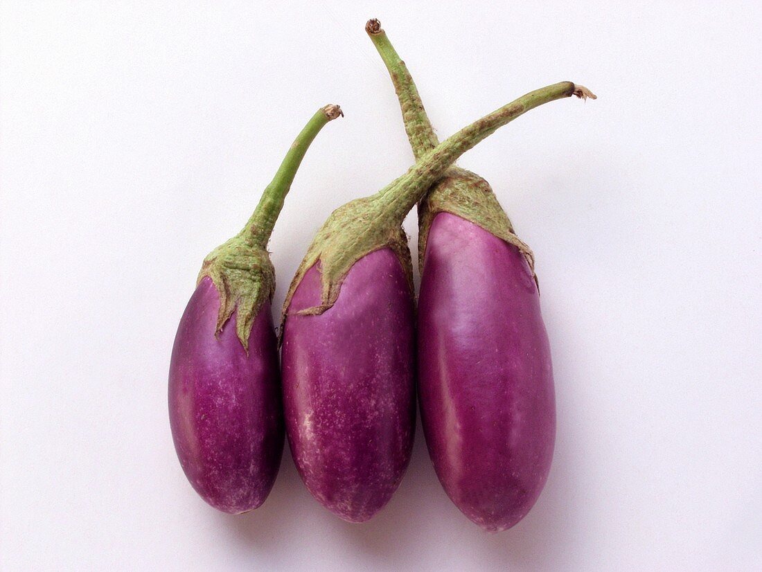 Three aubergines side by side
