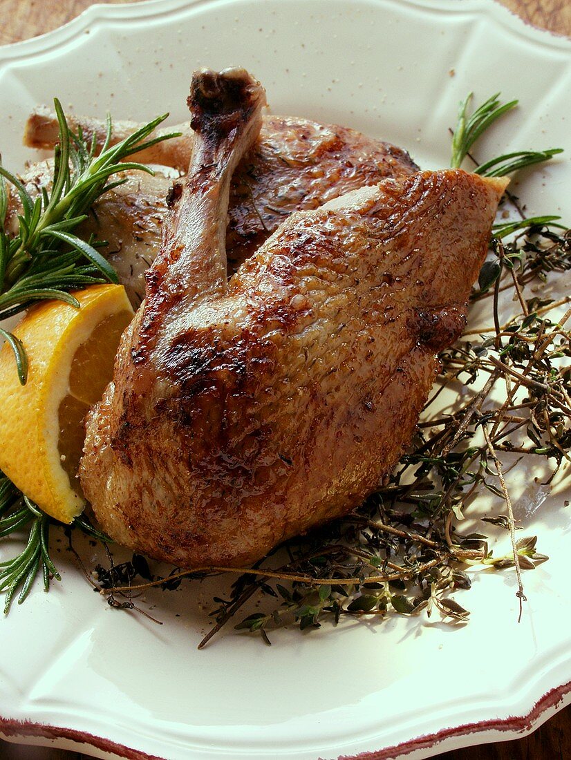 Roast legs of wild duck with herbs and lemon