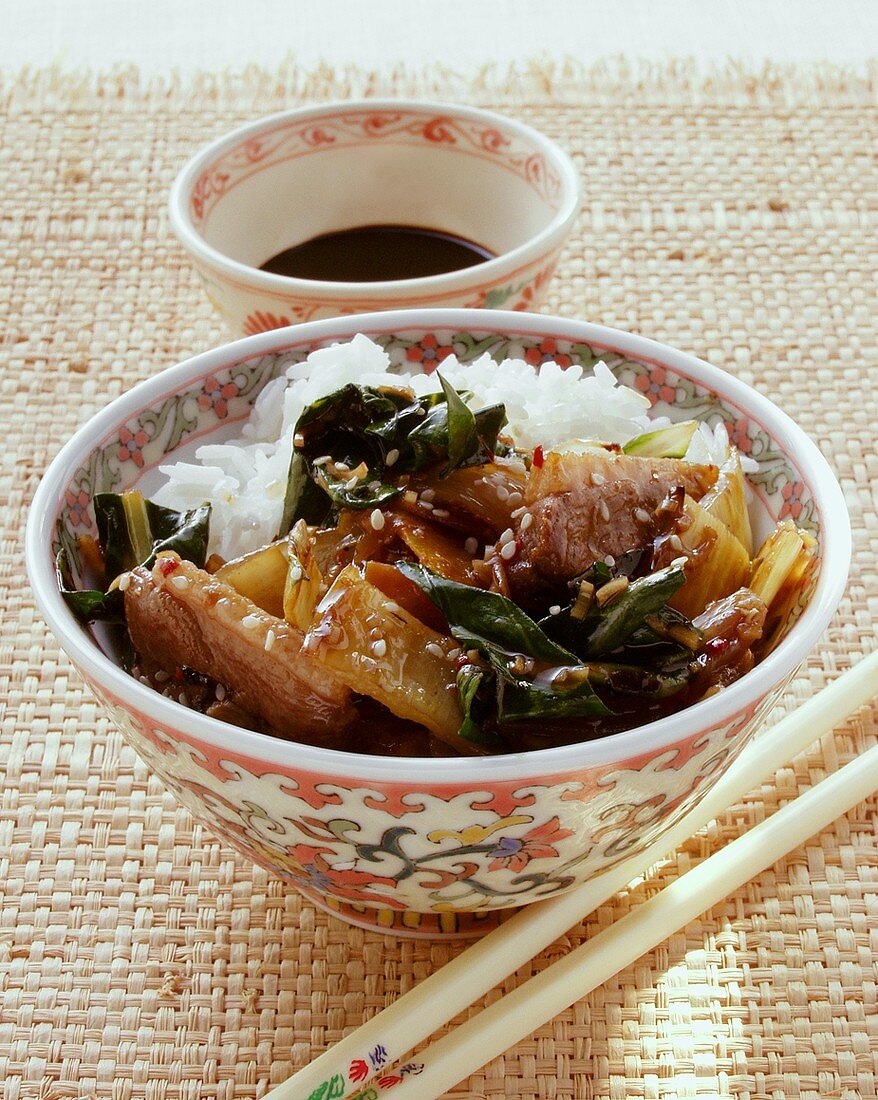 Duck with chard, sesame and rice; soy sauce