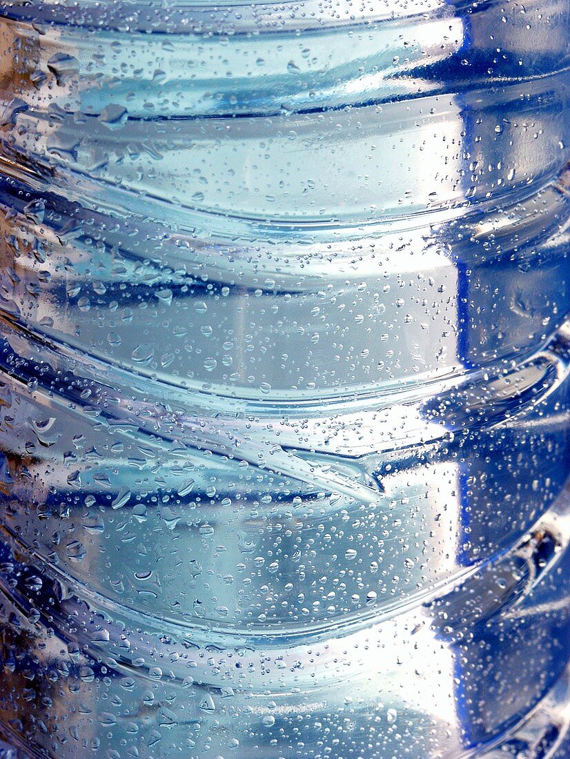 Drops of water on mineral water bottle (close-up)