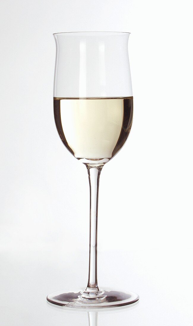 White wine glass, half filled