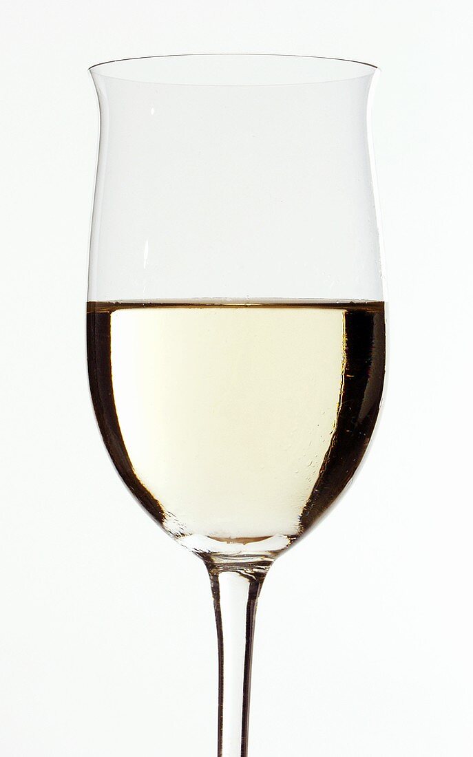 White wine glass, half filled