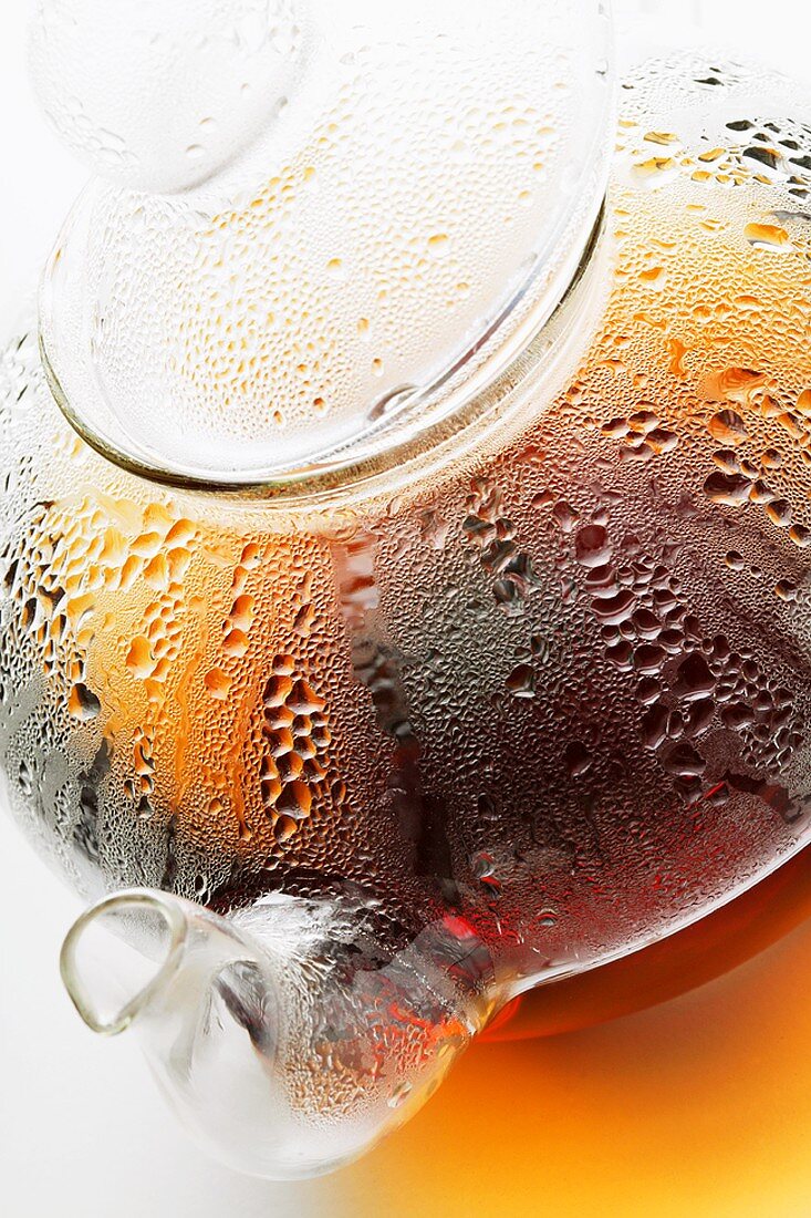 Hot tea in glass teapot