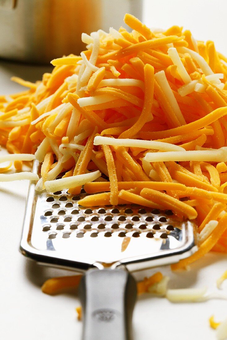 Coarsely grated Cheddar & Mozzarella with cheese grater