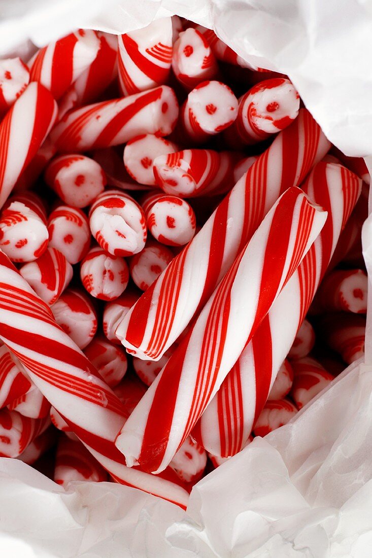Red and white candy canes in paper