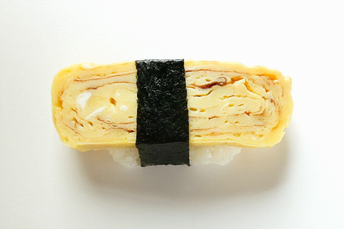 Nigiri sushi with egg and nori