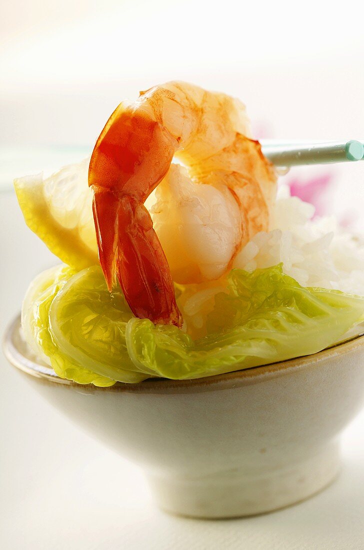 Shrimp with lettuce leaf on rice