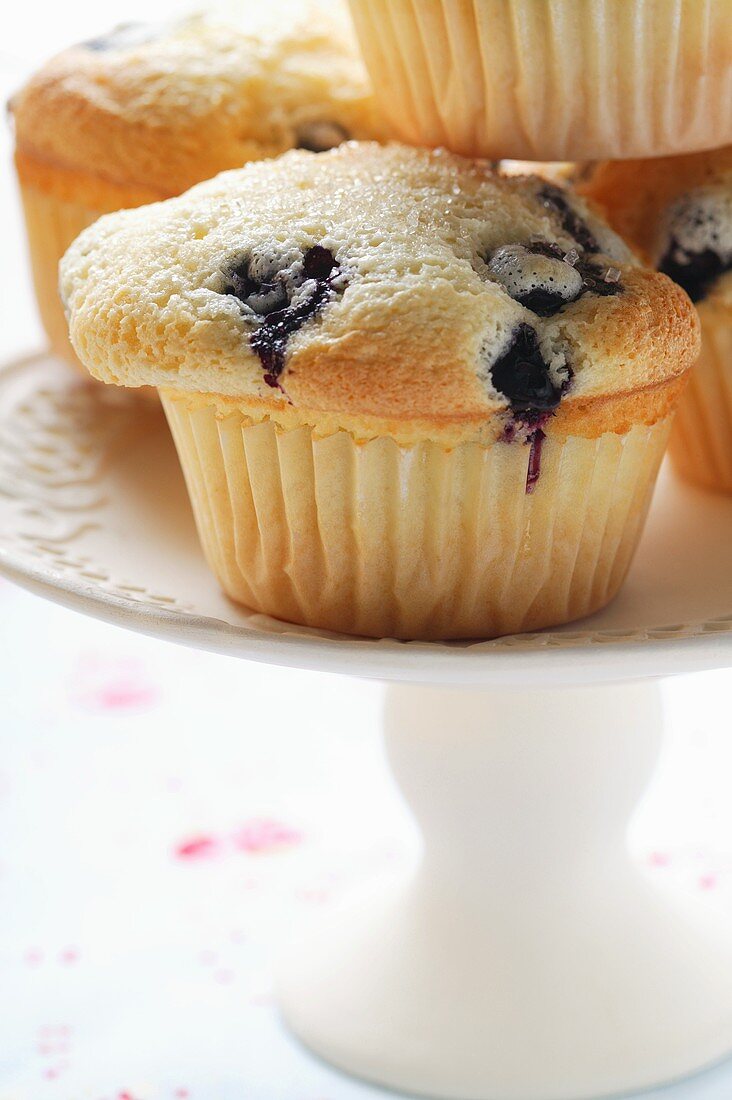 Blueberry muffins on cake plate