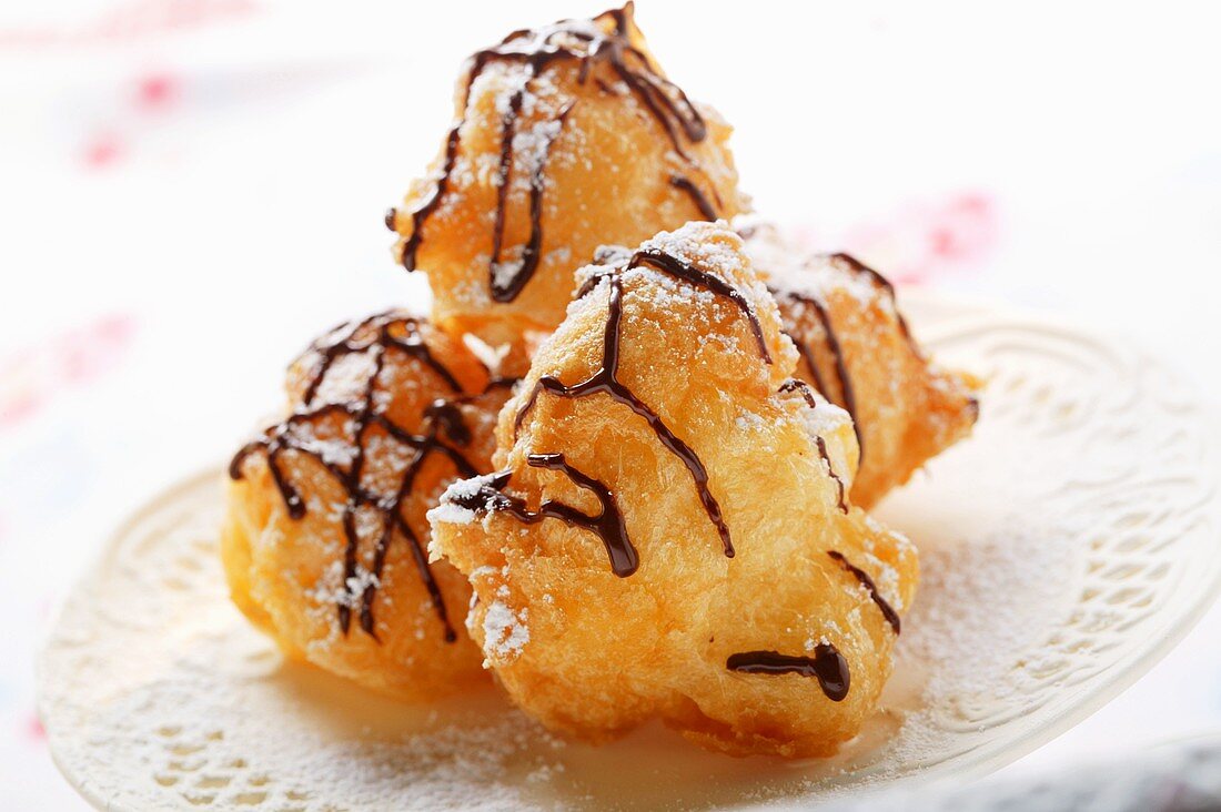 Chocolate doughnuts with icing sugar