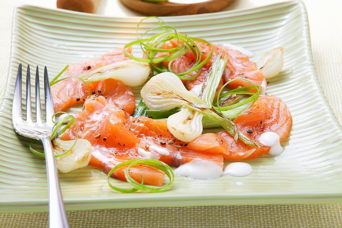 Salmon carpaccio with spring onions